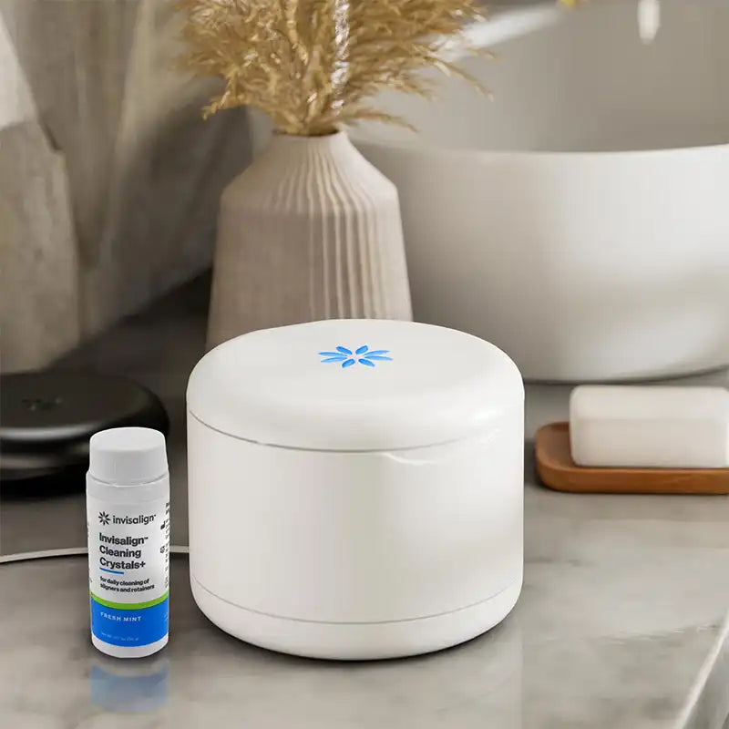 Invisalign Ultrasonic Cleaning Station next to Invisalign Cleaning Crystals+