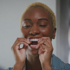 Person using the Invisalign cleaning system